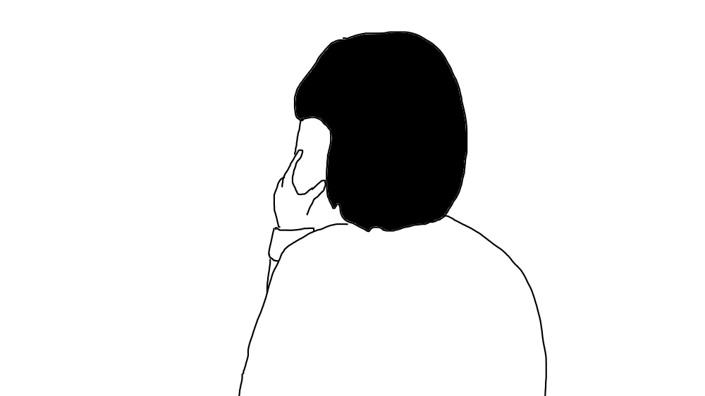 電話する背中